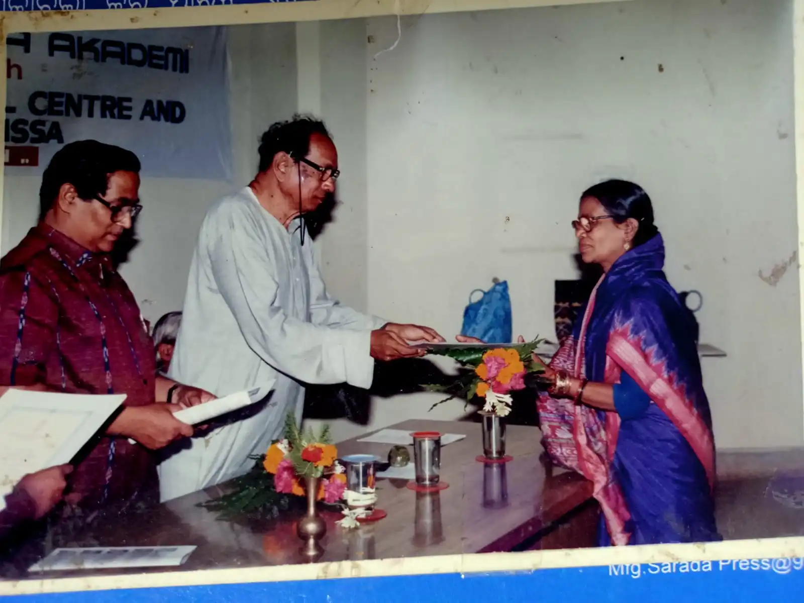 Basanta Kumari Samanta receiving the Water Colour Master honour from ONGC & IPCA