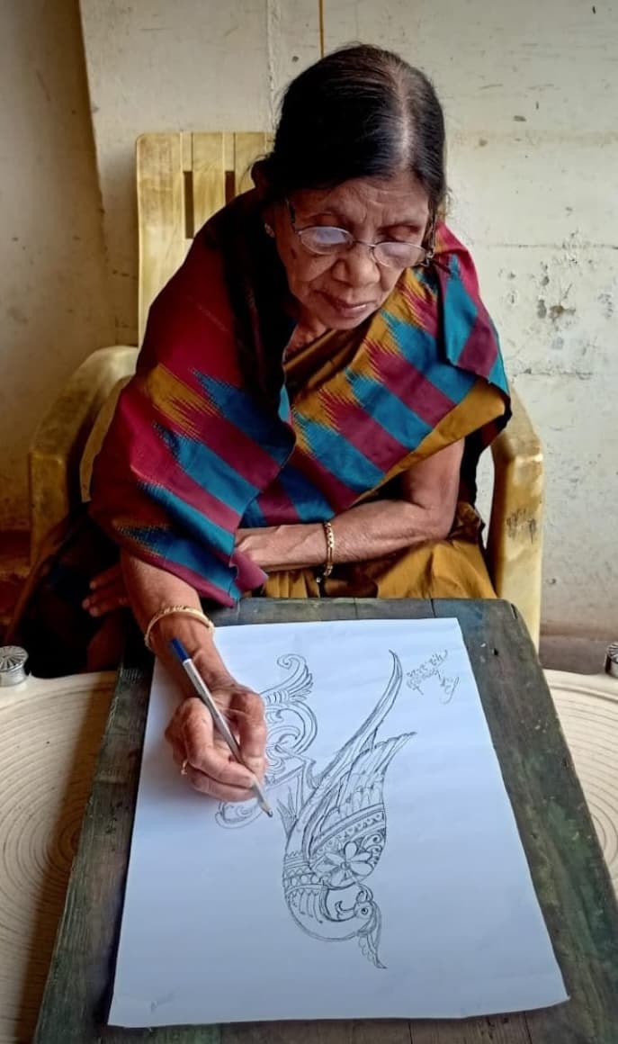 Basanta Kumari Samanta absorbed in a drawing session at her studio table