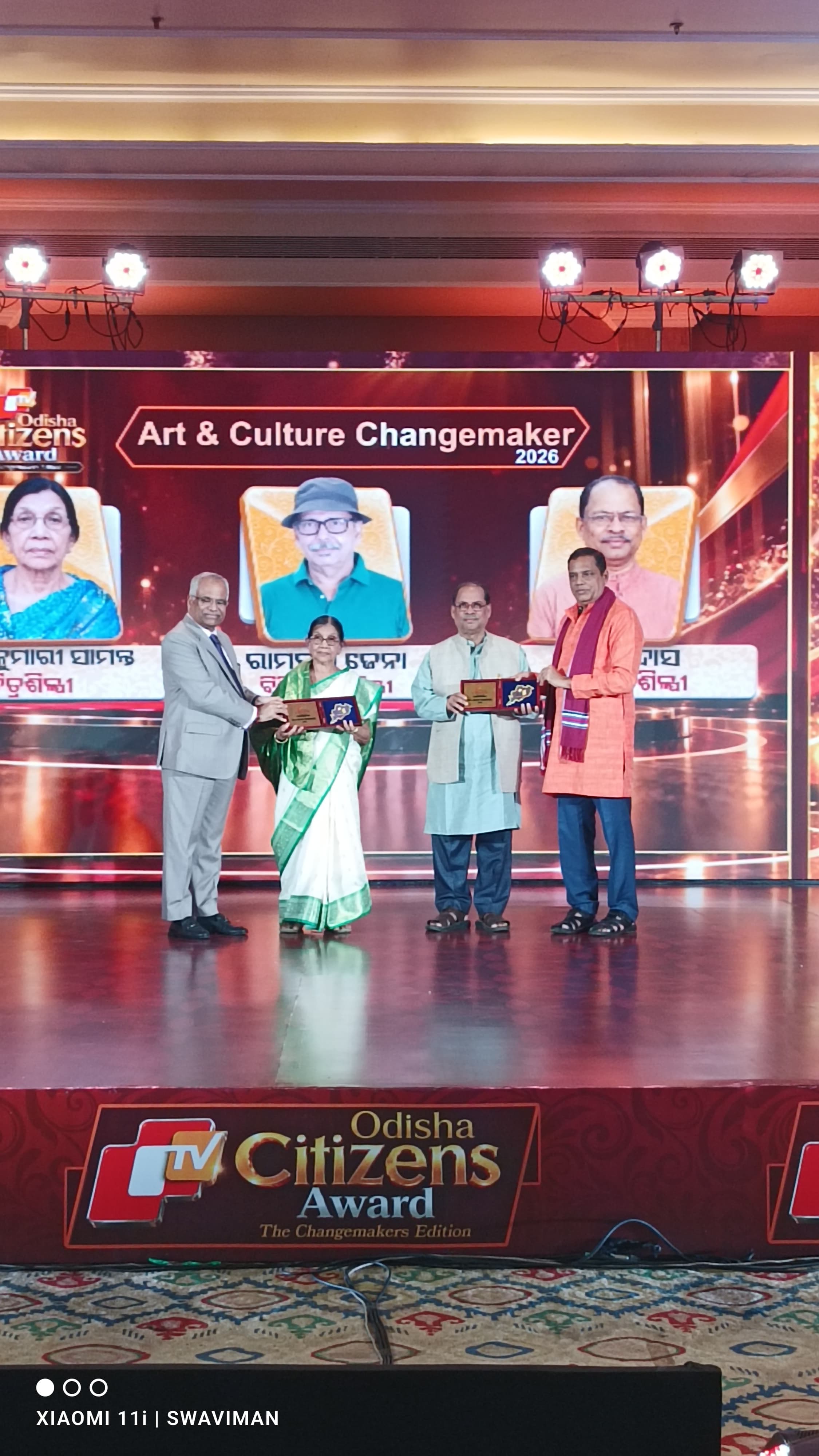 Artist Basanta Kumari Samanta receiving the OTV Odisha Citizens Award 2026 in the Art & Culture Changemaker category from Advocate General of Odisha Pitambar Acharya